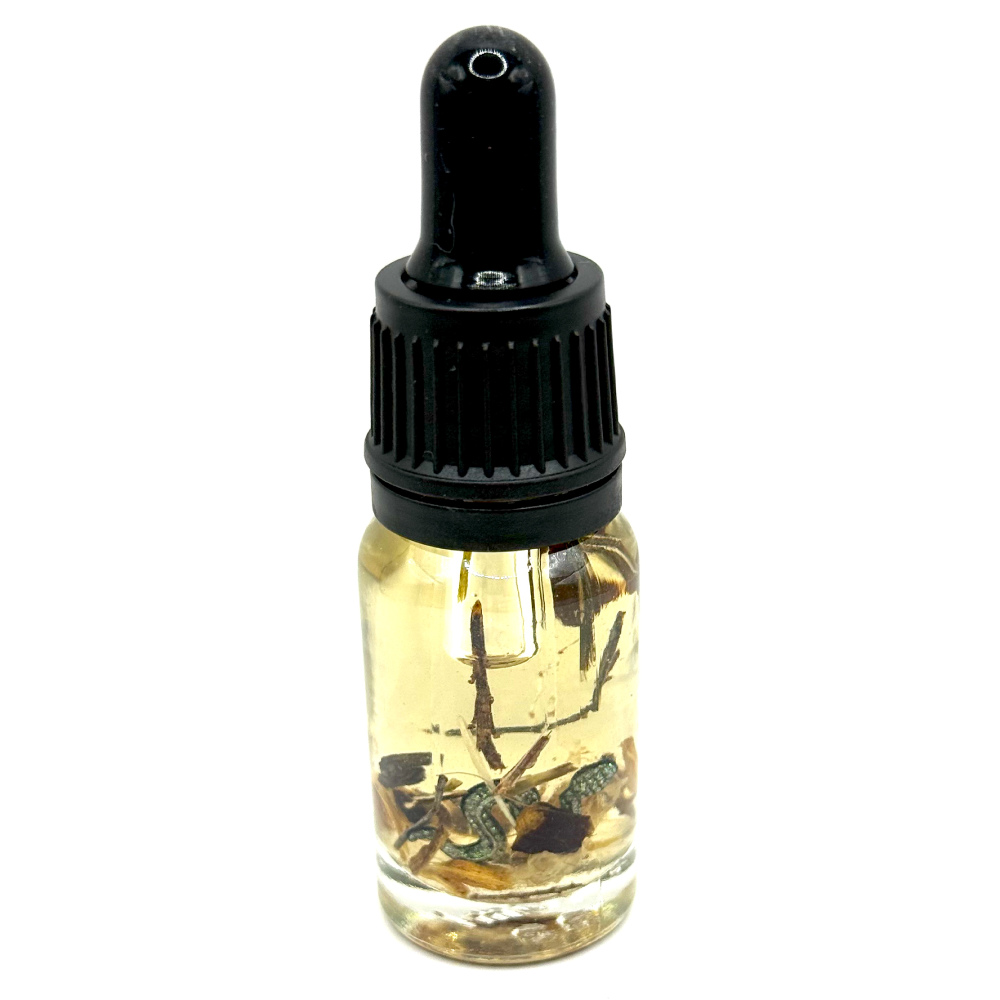 Serpent’s Coil Oil – transformative serpent-path ritual oil with patchouli, vetiver, vervain, star anise, liquorice root and ethically sourced python shed by The Wild Cauldron.